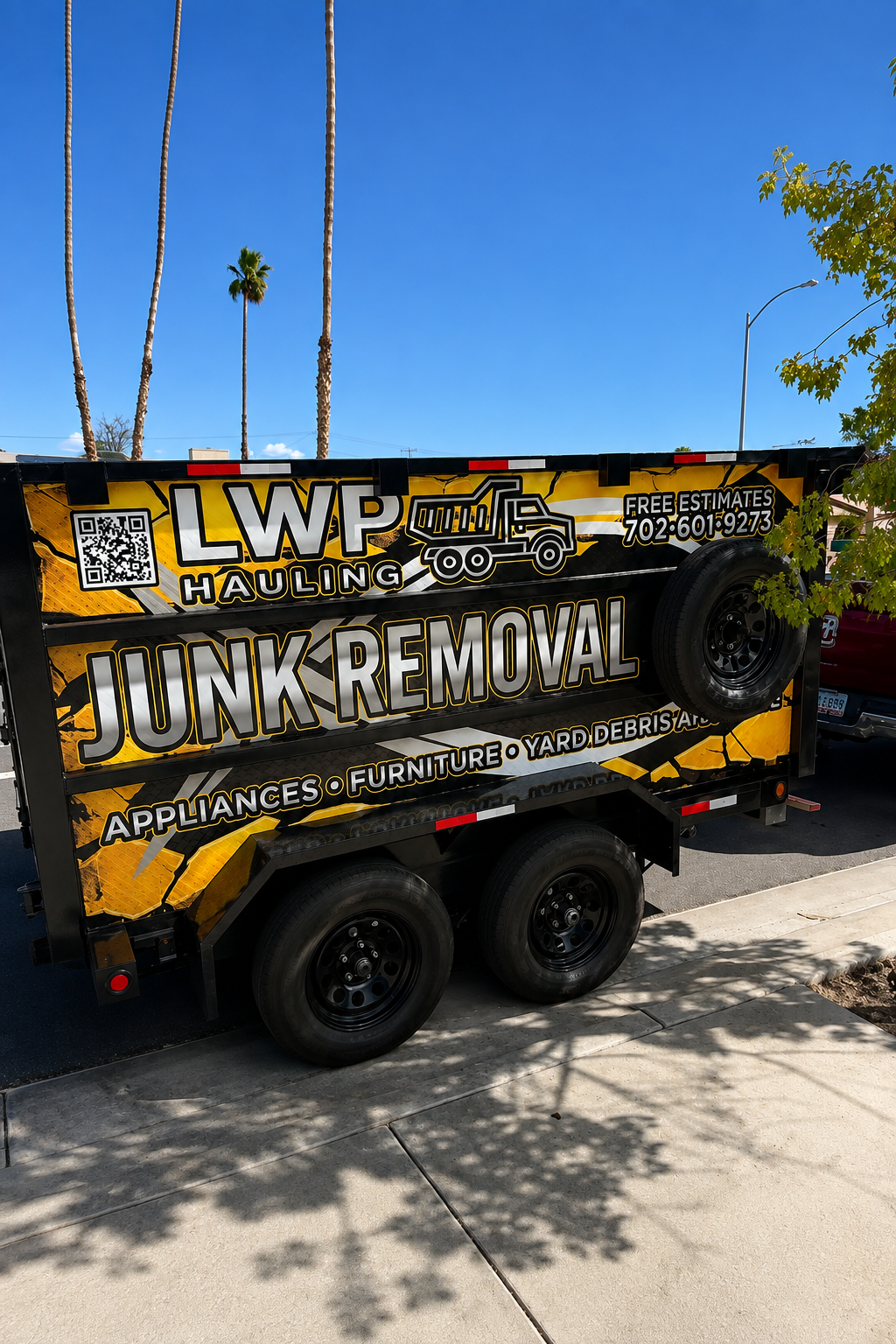 LWP Hauling branded dump trailer parked and ready for a junk removal job in Las Vegas
